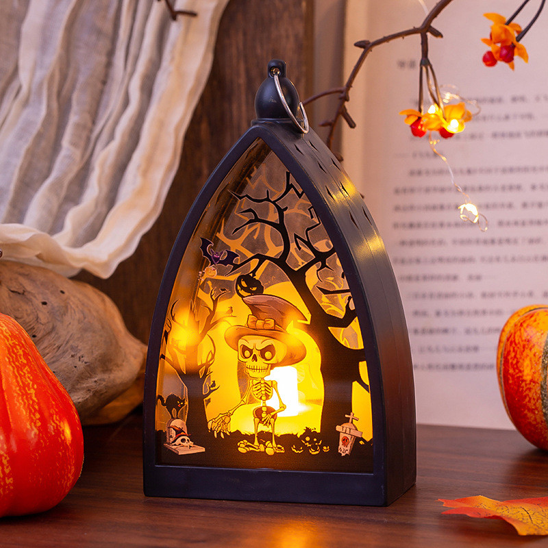 Photophore ajouré d’Halloween allumé, décor citrouille